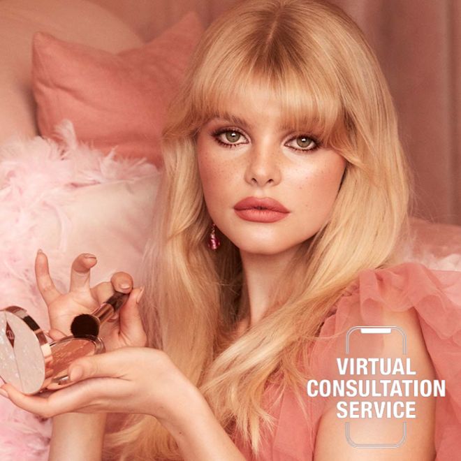 Pillow Talk virtual consultation Fair-tone blonde model with blue eyes wearing matte pink lipstick with glowy nude pink highlighter blush, and smokey brown eye makeup.