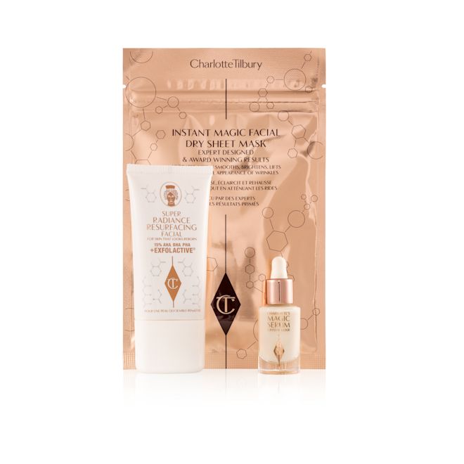 Magic Spa Facial Secrets displayed An exfoliating, wash-off mask in a white-coloured tube with a travel-size bottle of luminous face serum with a dropper lid, and a face mask in rose-gold-coloured foil packaging.