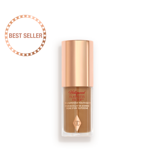 Hollywood Flawless Filter mini shade 6.5 closed A mini luminous primer in a medium-dark shade in a glass bottle with a gold-coloured lid.