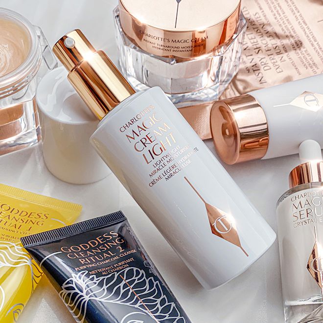 Skincare collection banner A collection of skincare that includes an open, face cream in a white-coloured bottle with a gold-coloured pump dispenser, luminous ivory-coloured serum in a glass bottle, charcoal facial scrub and lemon oil cleanser, day and night creams in glass jars with gold-coloured lids, and clay mask in a white tube with gold-coloured lid.