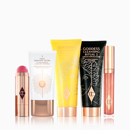 The Goddess Glow Kit Pack Shots The Goddess Glow Kit Pack Shots including Goddess Cleansing Ritual charcoal mask and oil, collagen lip bath lip gloss, beach stick blusher stick and unisex health glow tinted moisturiser.