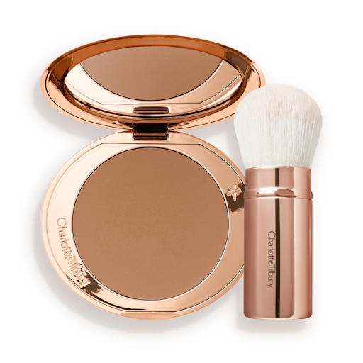 Kabuki Brush and Airbrush Bronzer open banner An open bronzer compact in a light brown shade and a kabuki brush with white-coloured bristles and a gold-coloured handle.