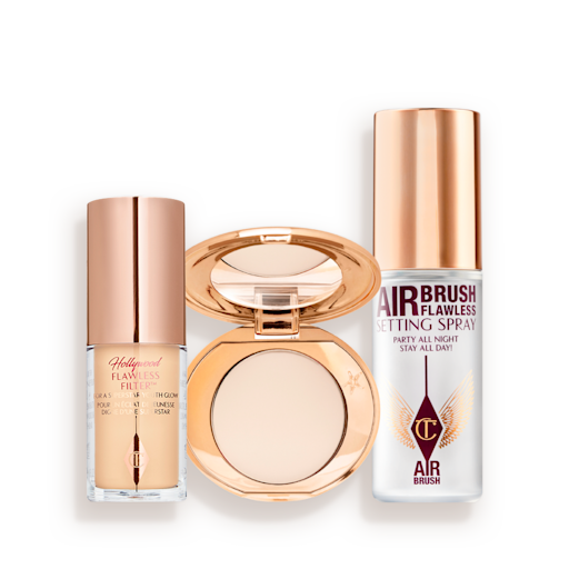Hollywood Flawless Filter, Airbrush Flawless Finish, and Setting Spray Travel Size Kit Travel-size kit that includes a glowy primer in a glass bottle with gold-coloured lid, face powder compact in a light shade with a mirrored-lid in gold-coloured packaging, and setting spray in a clear bottle with gold-coloured lid.