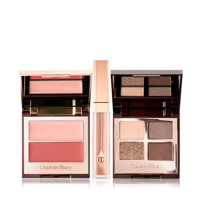 The Pretty Glow Look kit displayed Opn dual blush palette with light pink and dark pinkish peach blushes, a shimmery dark champagne lig gloss with a gold-coloured lid, and an open mirrored-lid quad eyeshadow palette with brown, grey, and beige eyeshadows.