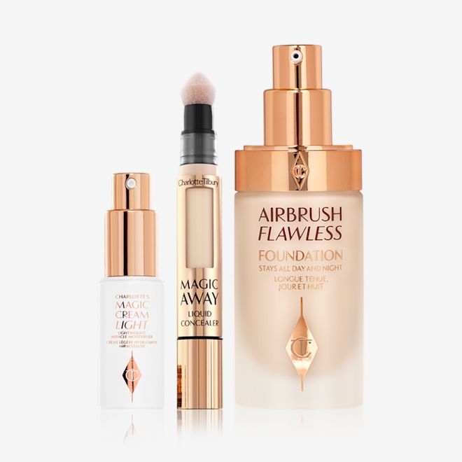 Magic Airbrush Complexion kit open Light face cream in a white-coloured bottle with a gold-coloured pump dispenser, concealer with a soft sponge-tip applicator, foundation in a glass bottle with a gold-coloured pump dispenser.