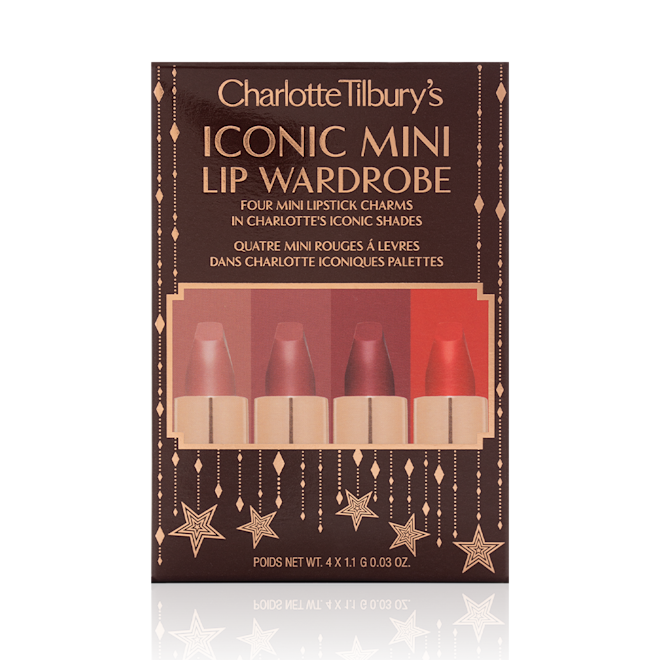 Charlotte Tilbury's Magic Icons kit sleeve Five matte lipsticks in nude shades of red and pink in their dark-brown gift set box with text written on the front that reads, 'Charlotte Tilbury's Iconic mini lip wardrobe'.