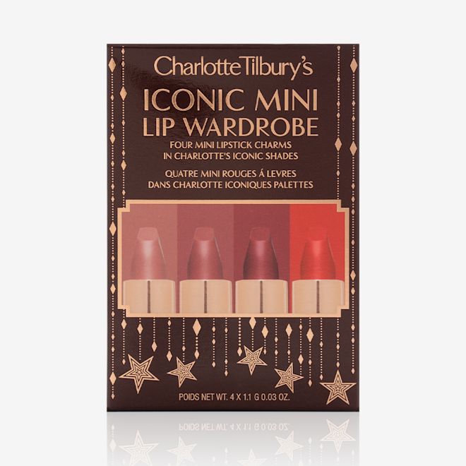 Charlotte Tilbury's Magic Icons kit sleeve Five matte lipsticks in nude shades of red and pink in their dark-brown gift set box with text written on the front that reads, 'Charlotte Tilbury's Iconic mini lip wardrobe'.