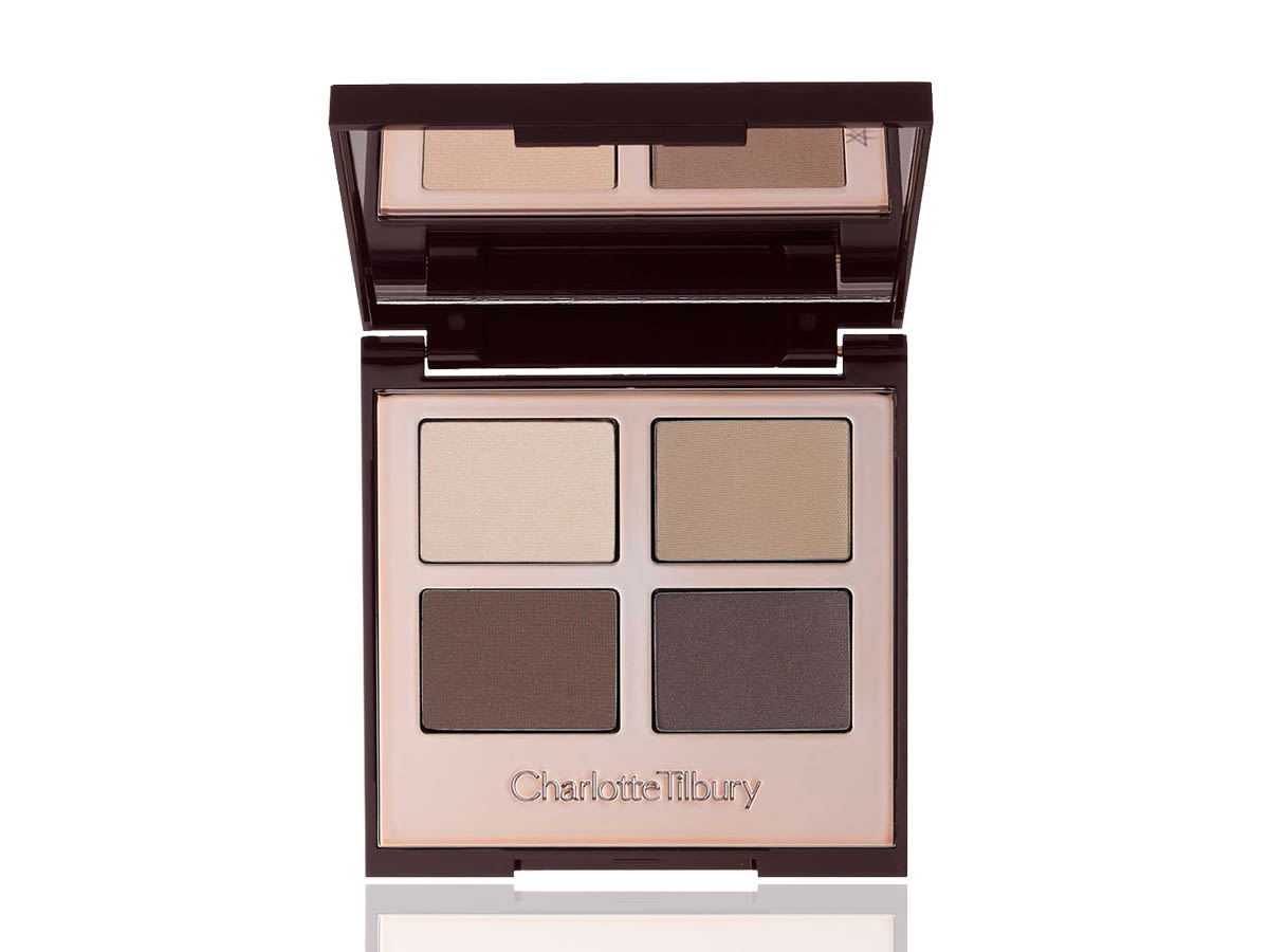 Luxury Palette eyeshadow palette in The Sophisticate open An open, mirrored-lid quad eyeshadow palette with matte eyeshadows in chocolate, taupe, tan, and cream shades