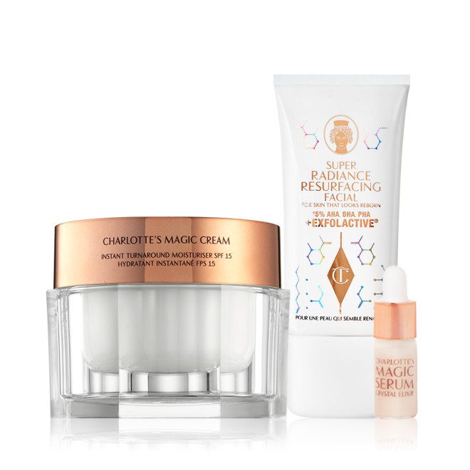 Thick, pearly-white cream in a glass jar with a gold-coloured lid with an exfoliating, wash-off mask in a white-coloured tube, and a sample-size face serum in a small bottle with a dropper lid.