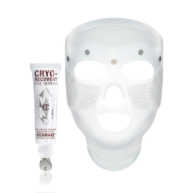 A white-coloured face mask with tiny holes all over the forehead and cheeks area, and large eye, nose, and mouth holes so the mask can comfortably sit on any face size or shape and an open white-coloured eye serum tube with silver-colour geometric patterns on the front and text written on it that reads, 'eye appear depuffed and brighter with Iceawake, caffeine complex'