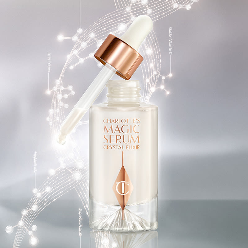 Magic Serum open An open, pearly-white face serum in a glass bottle with a dropper applicator, in white and rose gold colour scheme.