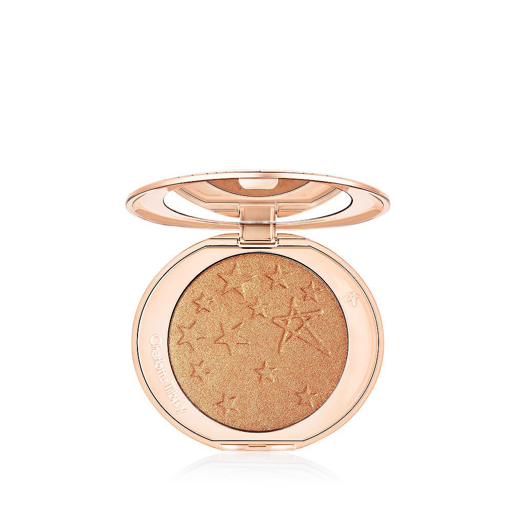 Hollywood Glow Glide Face Architect Highlighter in Sunset Glow packshot für Blog Charlotte's Hollywood Glow Glide Face Architect Highlighter in Sunset Glow, ein gold-kupferfarbener gepresster Highlighter.
