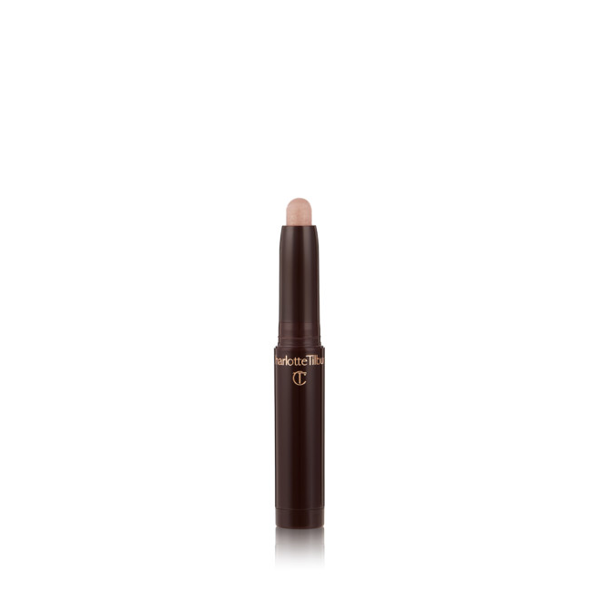 An open, cream eyeshadow wand in a champagne pink shimmer shade.