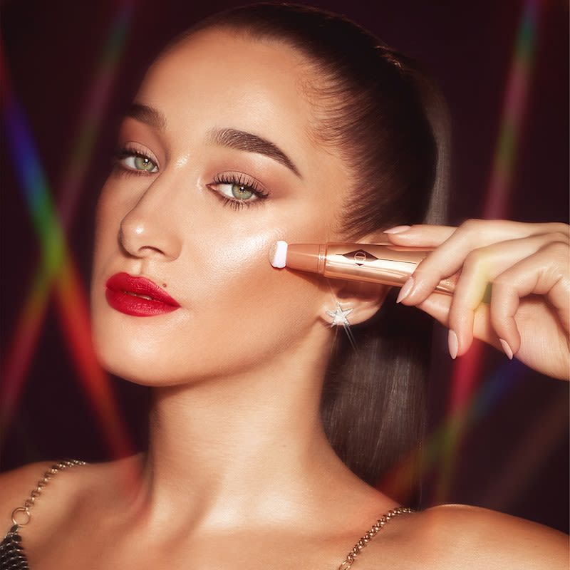 Bella black dress makeup Bella Tilbury wearing a disco glow black dress makeup look