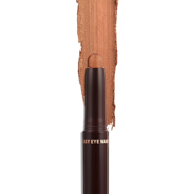 Quick & Easy Instant 5 Minute Kit Eyeshadow Stick in Golden glow open An open, cream eyeshadow wand in a golden bronze shimmer shade.