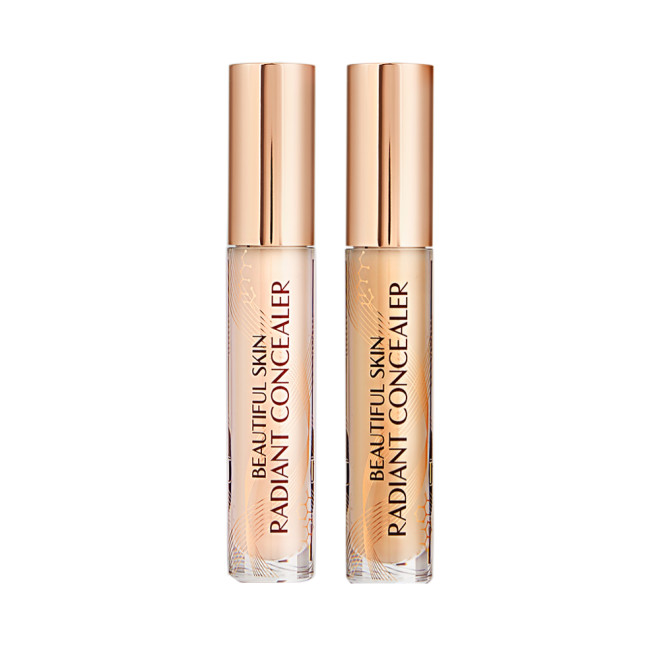 Two radiant concealers in glass tubes with gold-coloured lids, and text on the tubes that reads, 'Beautiful Skin Concealer'