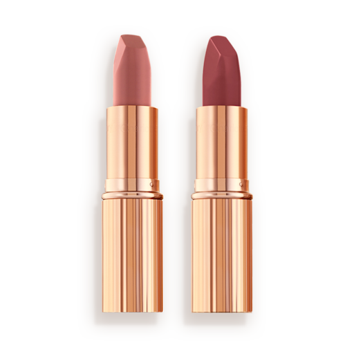 Matte Revolution Pillow Talk duo open Two matte lipsticks, one a nude pink and the other a berry-rose shade in golden, metallic tubes with their lids removed.