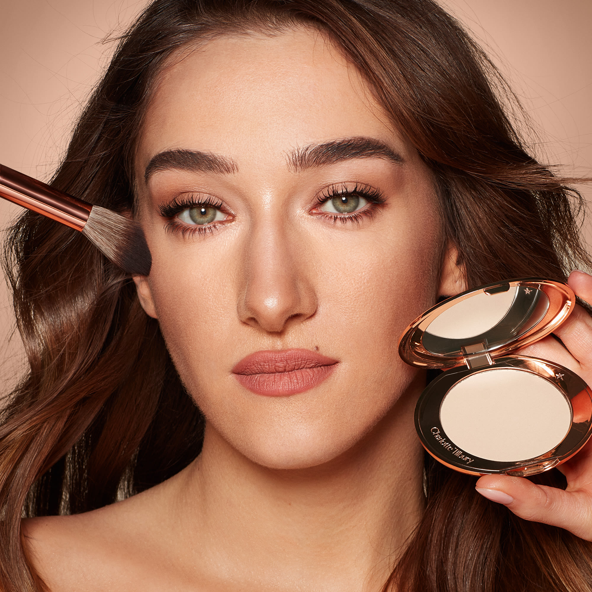 Bella Tilbury Airbrush Flawless Finish Bella Tilbury applying Airbrush Flawless Finish pressed powder with the Powder & Sculpt Brush