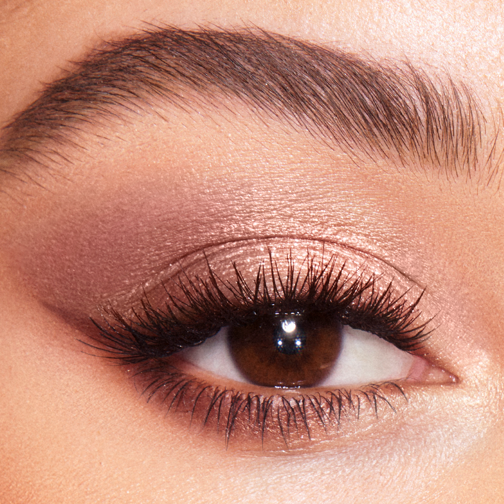 Model wearing Exagger-Eyes palette as a shimmering, rose-toned bridal eye makeup look