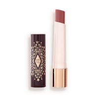 Hyaluronic Happikiss in Pillow Talk lid off An open, moisturizing lipstick lip balm in a nude pink shade with a black and gold-coloured cover.