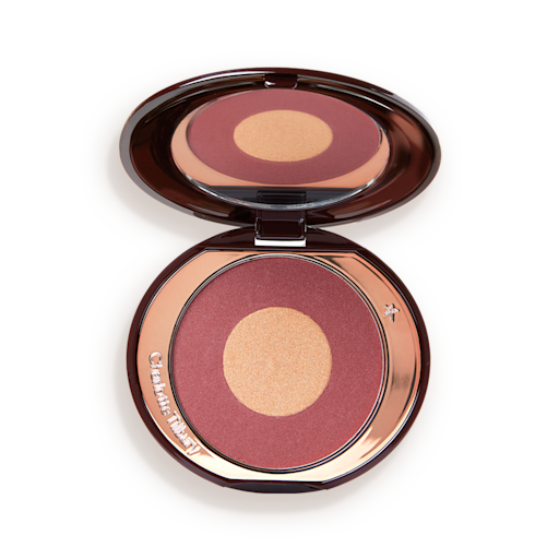 Cheek To Chic in Walk of No Shame open An open, two-tone powder blush compact in berry-pink and honey gold shades.