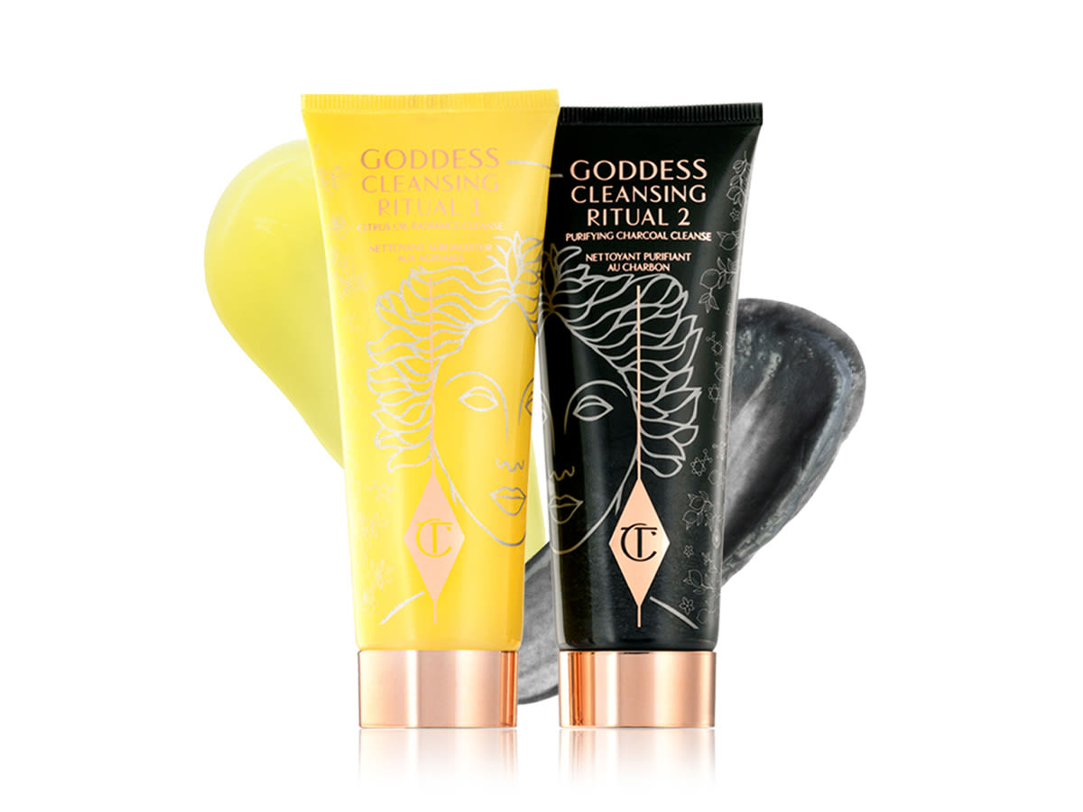 4x3 Goddess Cleansing Ritual paquet avec échantillon Two facial cleansers, one in lemon-yellow packaging and the other in charcoal-black, with rose-gold coloured lids.