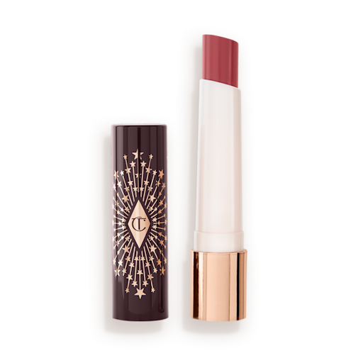 hyaluronic Happikiss in Romance Kiss lid removed An open lipstick lip balm in a sheer peach rose shade, in white and gold tube with a black-coloured lid with gold sparkles all over it.