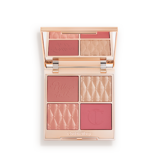 Pillow Talk Beautifying Face Palette in Fair open An open, face palette with matte and shimmery eyeshadows, blushes and highlighters in shades of pink and gold with a mirrored lid.