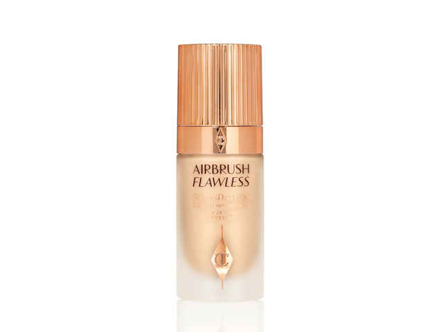 Airbrush Flawless Foundation displayed A light-beige foundation in a frosted glass bottle with a rose-gold-coloured lid.