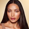 Quick & Easy Instant 5 Minute Sun-Kissed Look on medium-tone model medium-tone brunette model with brown eyes wearing sunset, sultry-pink eyeshadow, soft pink blush and lip stain, and dewy opal-coloured highlighter for a sun-kissed, glowing makeup look.