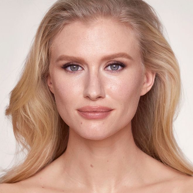 Airbrush Flawless Foundation on fair-tone model Fair-tone blonde model wearing glowy foundation in a cool-tone, light-beige shade that covers her pores and makes her skin look flawless and youthful.