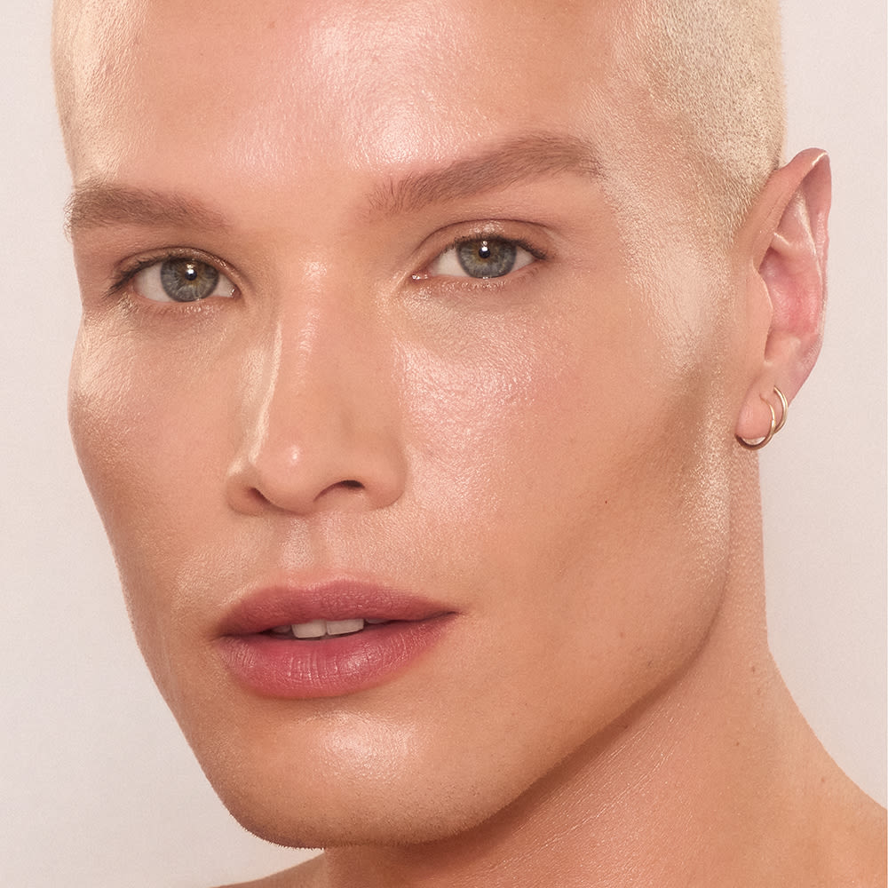 Daniel Unreal Skin Daniel wearing shade 6 of Charlotte's Unreal Skin skin tint
