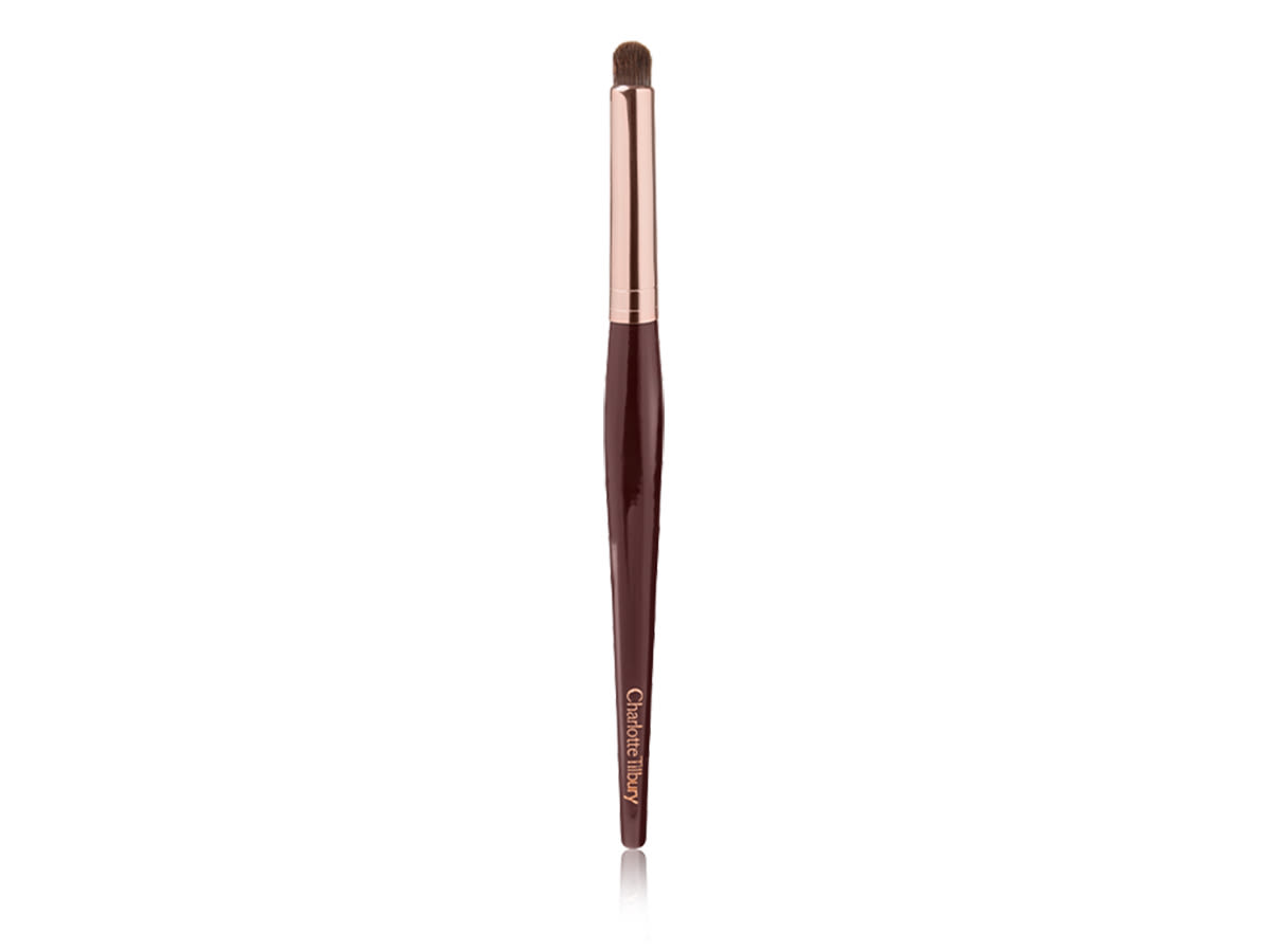 Eye Blender Brush An eyeshadow and eyeliner brush in a golden and dark crimson colour scheme.