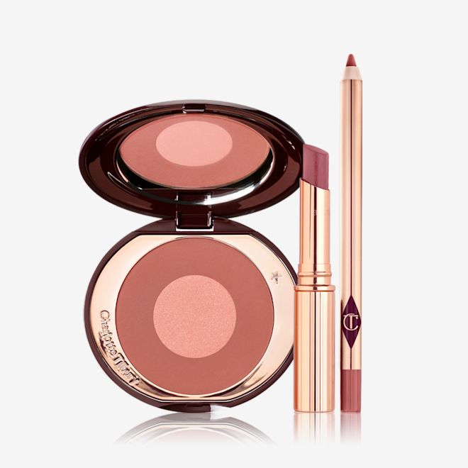 Superstar Lip and Cheek Makeup Kit open An open, mirrored-lid two-tone blush in shades of terracotta and rose gold with an open lipstick lip balm in sheer berry-rose shade with an open lip liner in pinkish-brown shade.