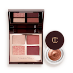 Eyes to Mesmerise and Luxury Palette Kit open An open, mirrored-lid quad eyeshadow palette with beige, rose gold, russet brown, and maroon shades and cream eyeshadow in a nude pink shade in a petite, open pot with its lid removed.