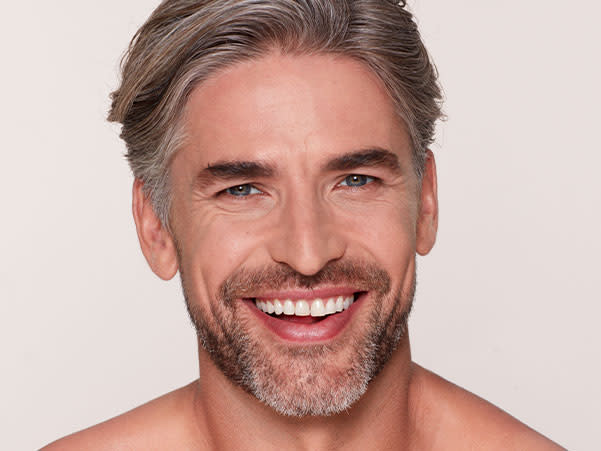 Magic Gifts for him Charlotte Tilbury male model applying Magic Away concealer