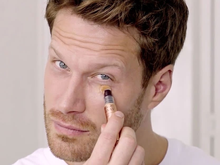 Magic Gifts for him Charlotte Tilbury male model applying Magic Away concealer
