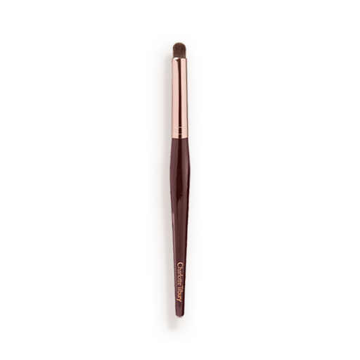 Synthetic Eye Smudger Brush An eyeshadow smudging brush with soft bristles and rose gold and dark crimson handle.