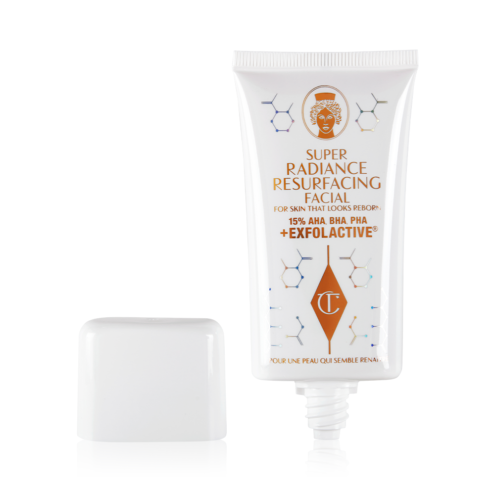 Super Radiance Resurfacing Facial open An exfoliating, wash-off, chemical mask in a white-coloured tube with its lid next to it.