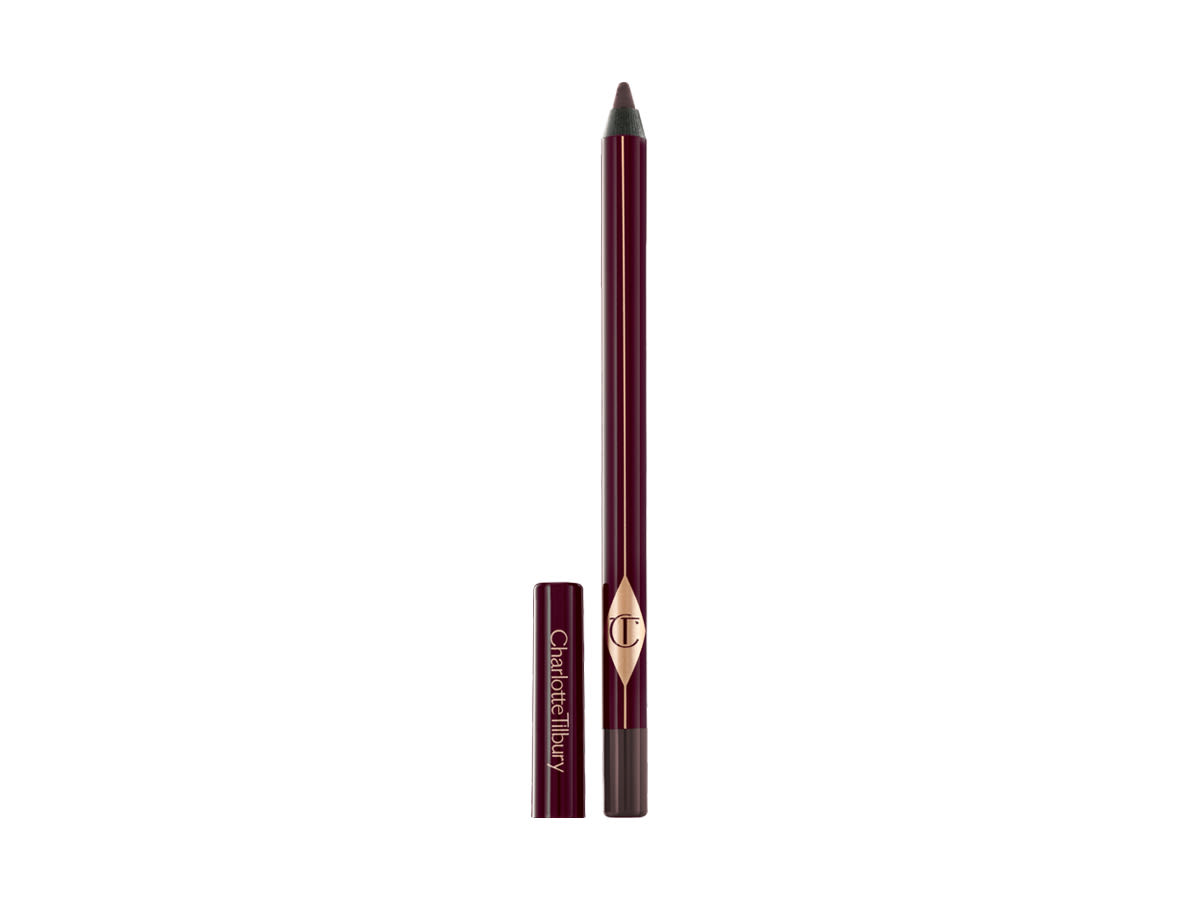 Rock N Kohl in Barbarella Brown An open, dark brown kohl eyeliner pencil with its lid next to it.