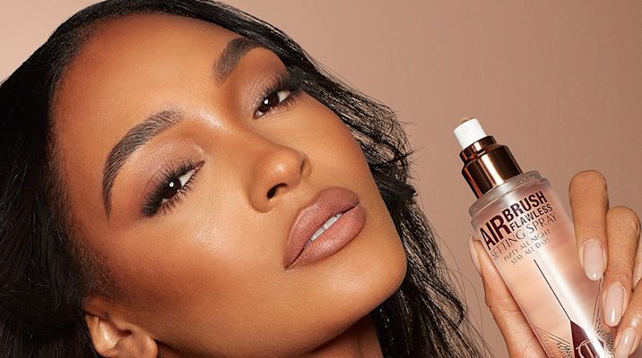 Jourdan Dunn holding Airbrush Flawless Setting Spray
