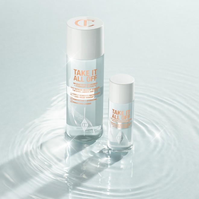 Regular and travel-size makeup removers with white-coloured lids in clear bottles with text that reads, 'Take it all off'.