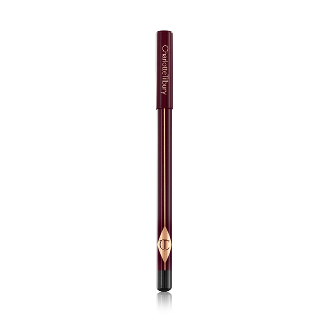 A closed, eyeliner pencil in burgundy packaging with the CT logo printed on it. 