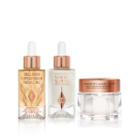 A light-gold-coloured facial oil in a glass bottle with a gold and white-coloured dropper lid, luminous, ivory-coloured facial serum in a glass bottle with a white and gold-coloured dropper lid, and pearly-white face cream in a glass jar with a gold-coloured lid. 