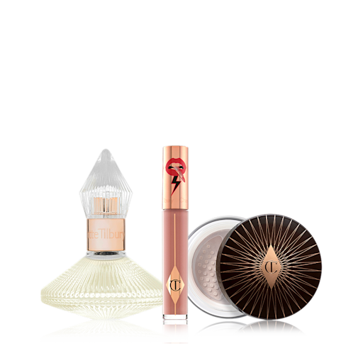 Charlotte's Dream Trio displayed A 100 ml perfume in a glass bottle with with a glass lid with a liquid lipstick in a nude brown shade with a golden-coloured lid, and loose powder with a black and gold-coloured lid.