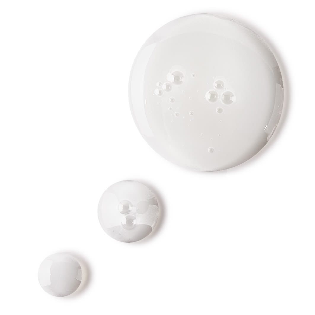 Glow toner swatch Pearly-white drops of a watery facial toner with a luminous finish.