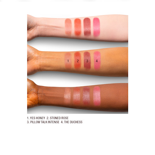 K.I.S.S.I.N.G lipstick in Medium shades arm swatch Arm swatches on fair, medium, and dark-tone models of satin-finish lipsticks in nude shades.