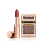 An open lipstick in a salmon-pink colour in a gold-coloured tube with a single-pan eyeshadow compact in an iridescent smokey grey eyeshadow with very fine shimmer. 