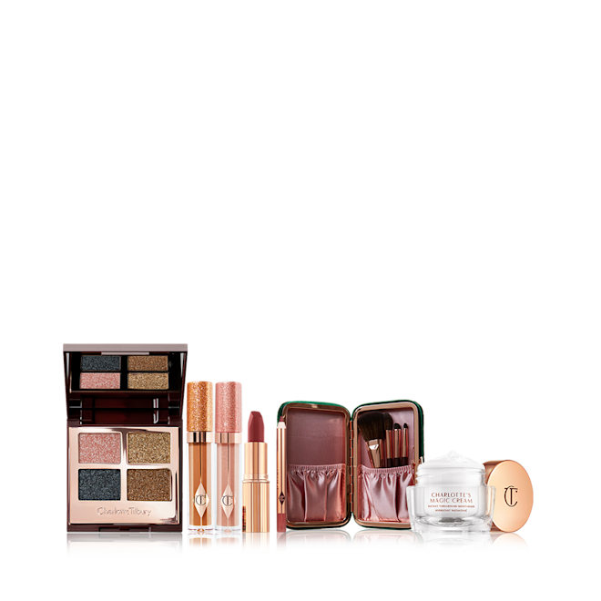 Charlotte's Ultimate Gift of stocking fillers displayed an open, mirrored-lid quad eyeshadow palette with shimmery eyeshadows in rose gold, teal, honey-gold, and bright gold colours, shimmery lip glosses in champagne and pink, lipstick and lip liner pencil in winter-berry, face and eyeshadow brush set with pouch, and pearly-white face cream in a glass jar.