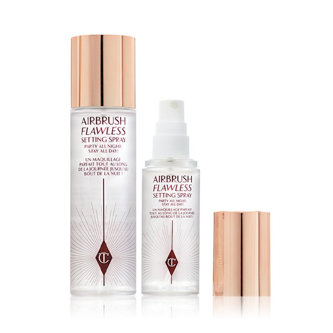 Airbrush Flawless Setting Spray kit Travel-size and full-size setting spray in clear bottles with gold-coloured lids.
